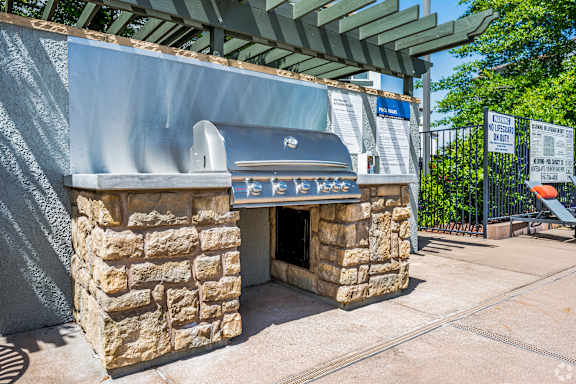 A stone structure with a sign that says "BAR" on it.