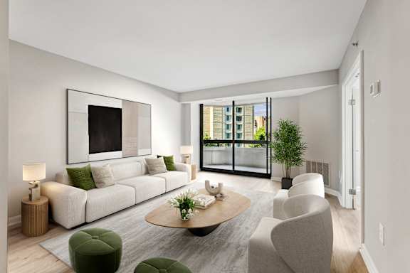 a living room with a white couch and a table    and a balcony