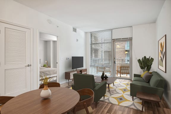 a living room with a couch and a table and a tv