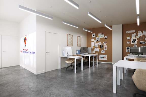 a room with desks and chairs and a wall with pictures and papers on it