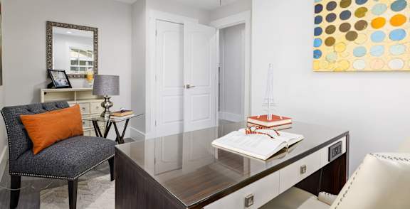 A kitchen with wooden cabinets and a white refrigerator.