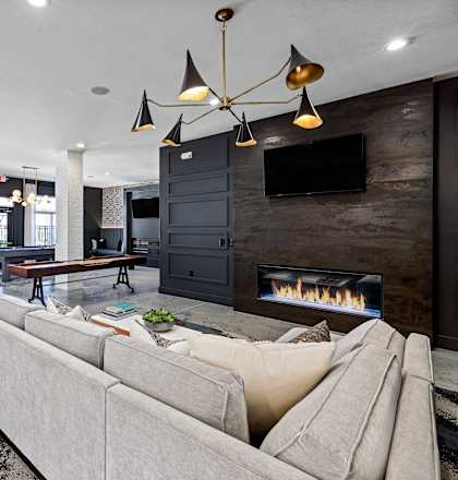 a living room with a couch and a fireplace
