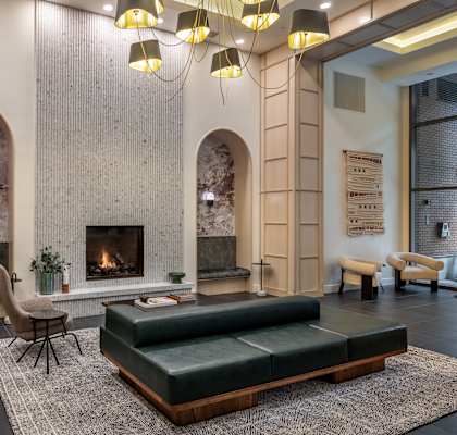 a living room with a fireplace and a couch