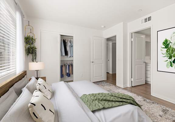 a bedroom with a large bed and a closet
