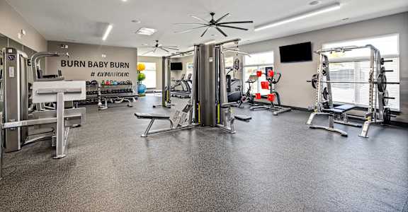 the weights room at the flats at bunny bay gym