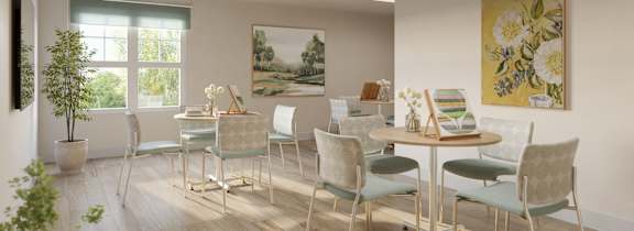 A room with a table and chairs and a painting on the wall.