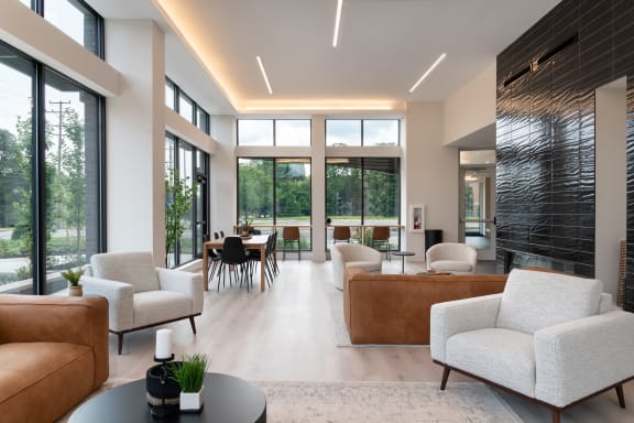a living room with couches and chairs and a table at ORRIS Apartments, Rocky River