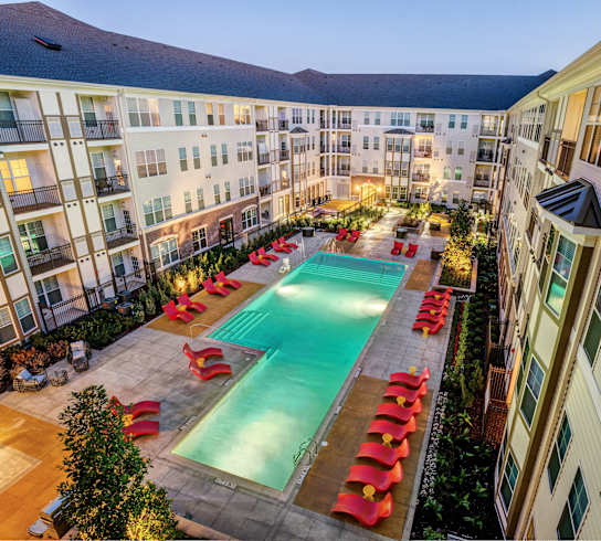an aerial view of an apartment complex with a swimming pool at Aspire Apollo, Camp Springs, MD