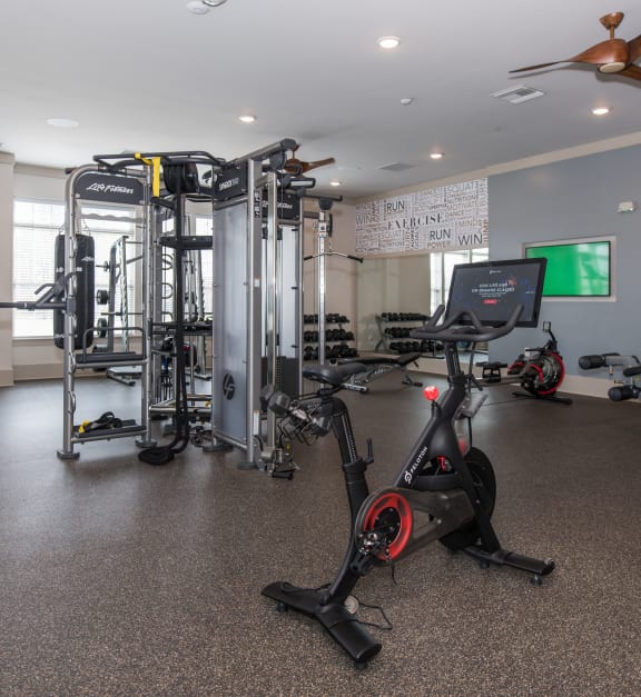 a gym with a lot of exercise equipment at The Whitworth, Williamsburg Virginia