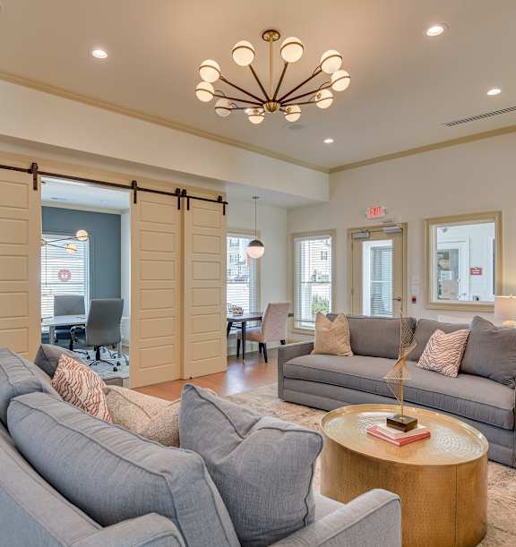 an open kitchen and dining area with a marble counter top