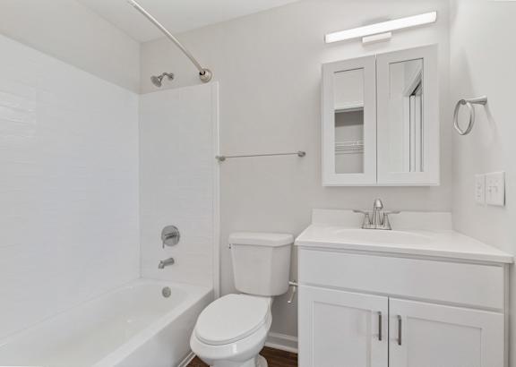 a bathroom with a toilet sink and bathtub