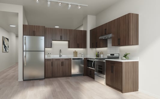 a kitchen with wooden cabinets and stainless steel appliances