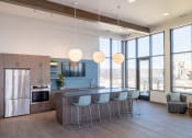 Thumbnail 9 of 11 - a view of the kitchen and living room from the dining area