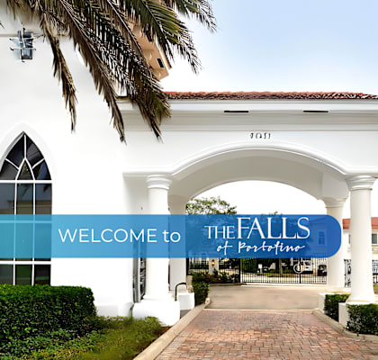a white building with a blue sign that reads welcome to the halls of fame