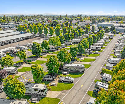 an aerial view of a parking lot filled with parked rvs
