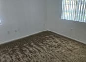 Thumbnail 6 of 7 - A carpet with a distinctive pattern is on the right side of the image.