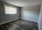 Thumbnail 14 of 17 - a window with blinds in a room with a whitewall