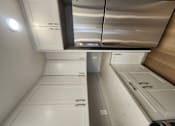 Thumbnail 43 of 51 - a kitchen with white cabinets and stainless steel appliances