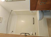 Thumbnail 7 of 15 - a kitchen with a sink and a faucet in the corner of a room