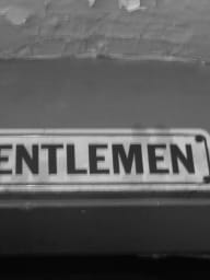A vintage sign board for gentlemen.