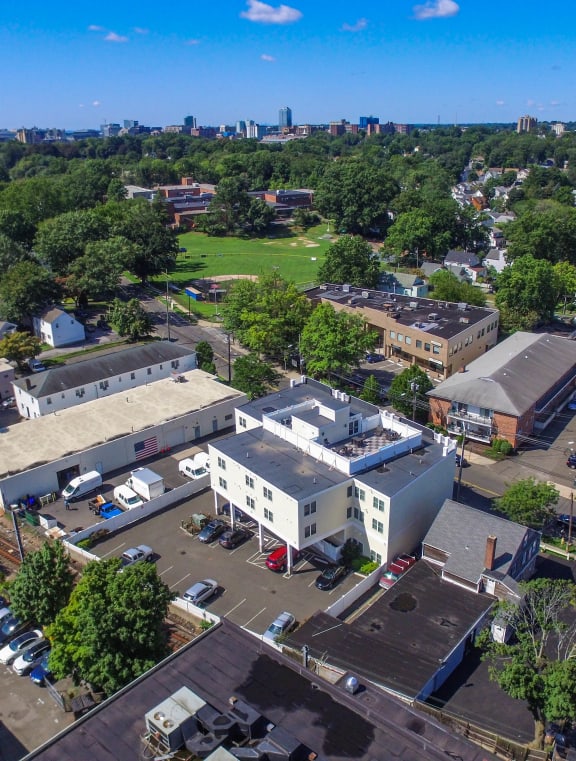 an aerial view of the campus with the city in the background