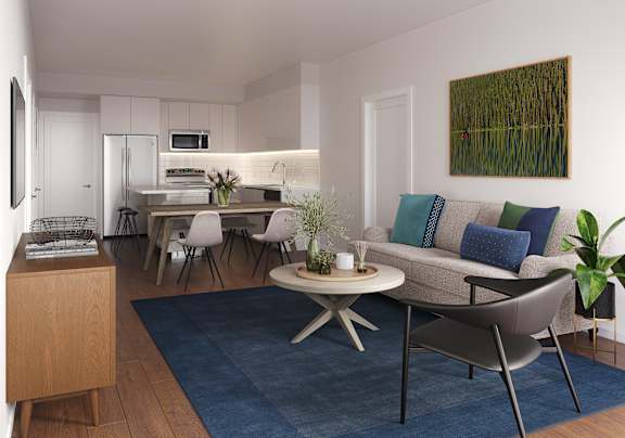 A modern living room with a grey couch and a coffee table.at 66 Main, Yonkers, NY