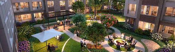 Outdoor courtyard with firepit at Autry at Legacy apartments in Prosper, TX.