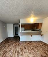 a small room with a small bed and a small window