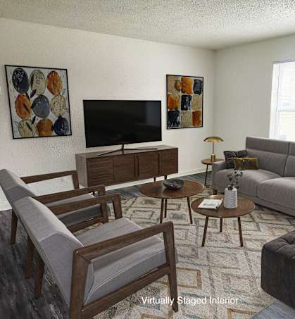 a living room with couches and chairs and a television