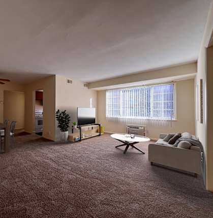 an empty living room with a couch and a table at Huntington Green Apartments, University Heights, 44118