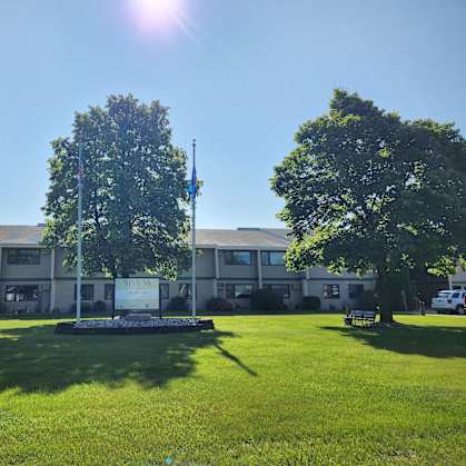 A building with a flagpole in front of it.