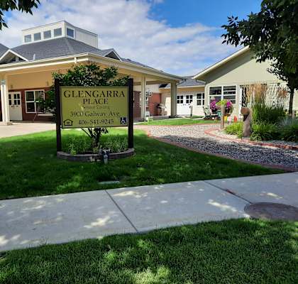 a picture of the glencarron place sign in front of the building