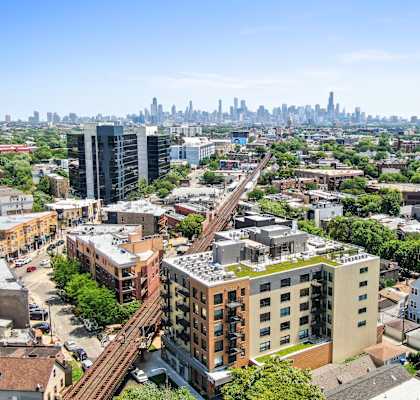 A cityscape with a mix of residential and commercial buildings.