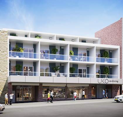 a rendering of a building with balconies on a city street