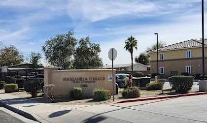 The image shows a street view with a sign for Mantonilla Terrace.