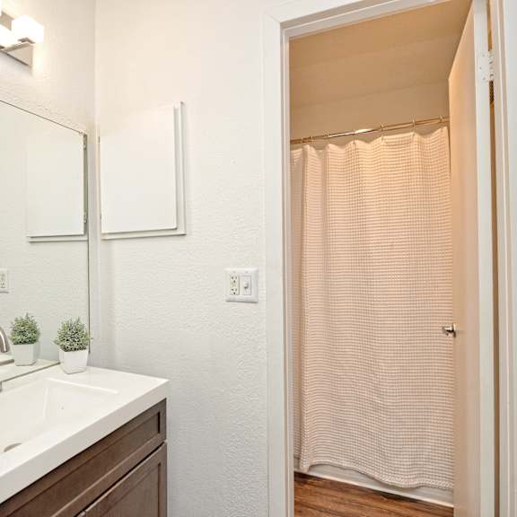 a bedroom with a bed and a ceiling fan at Peaks at Northwest Hills Apartments, Austin