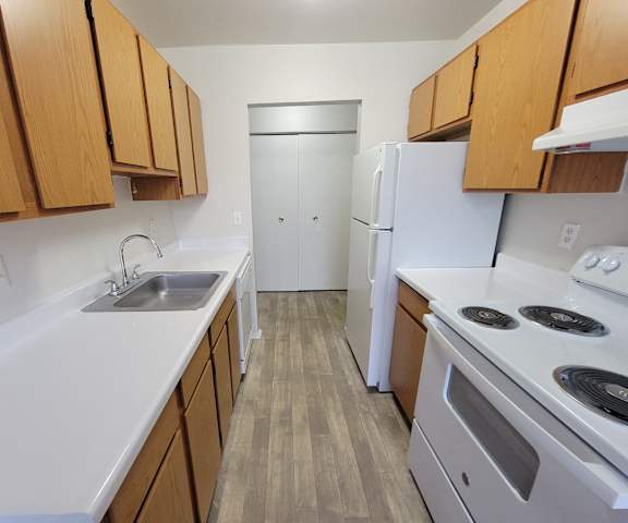Spacious kitchen with appliances at Garfield Commons Apartments in Clinton Township, MI