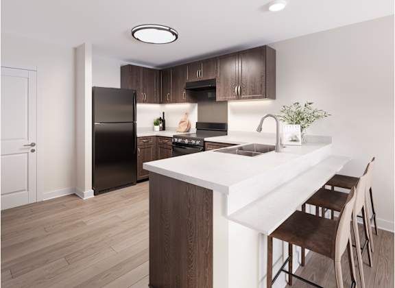 A kitchen with a black refrigerator and brown chairs. at Evergreen Heights Apartments, Ohio, 43614