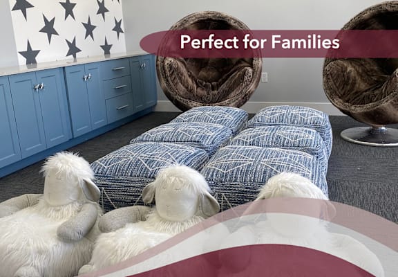 a bedroom with sheep laying on a bed and the words perfect for families