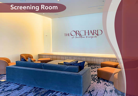 a screening room with a blue couch and chairs