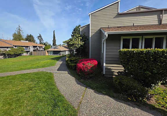 A residential area with houses and a clear sky.