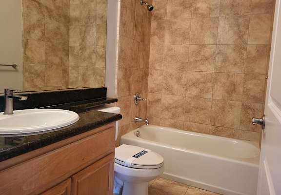 a bathroom with a sink toilet and bathtub
