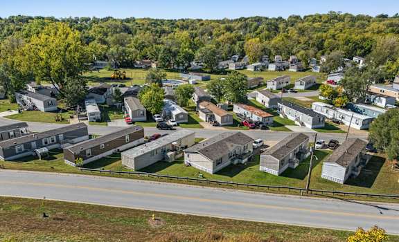 A suburban neighborhood with houses and trees.