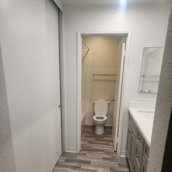 2x2D Bathroom with a toilet and a mirror.