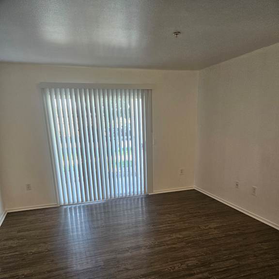 A window with blinds is on the wall.