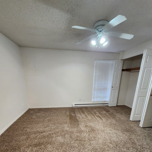 a room with a ceiling fan in it