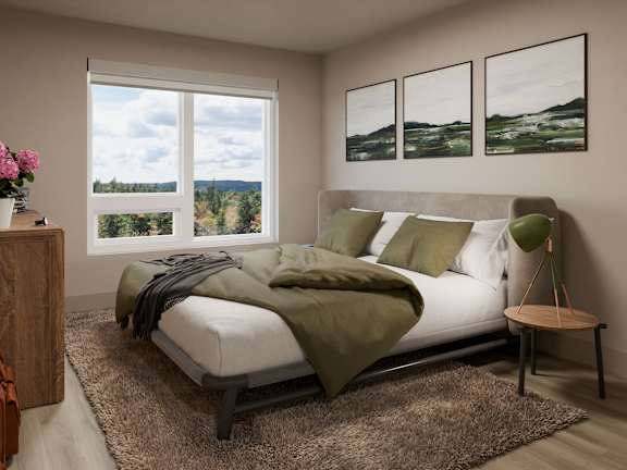 A bedroom with a large bed and a view of the countryside through the window.