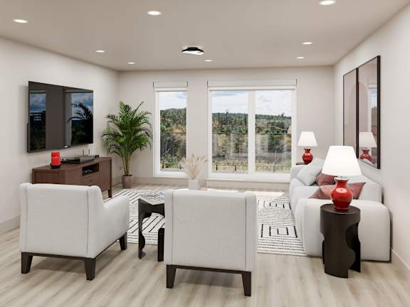 A modern living room with white furniture and a flat screen TV.