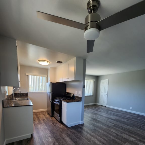 a view of a living room with a ceiling fan