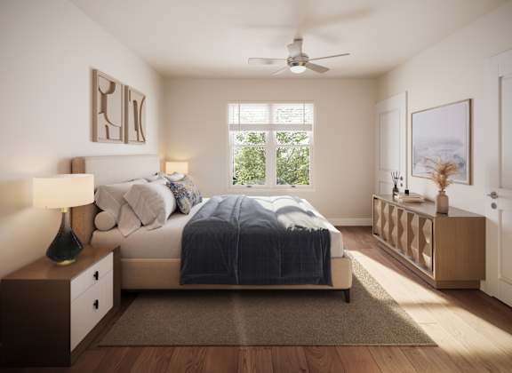 A bedroom with a bed, nightstand, and a ceiling fan. at Bretton Woods II Apartments, Ohio, 43231